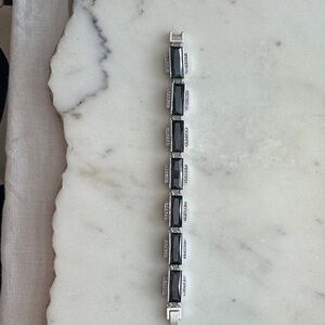 “On Stage “ Elegant Genuine Jet Black and clear CZs in a Silver tone Setting